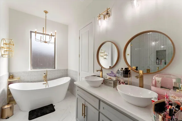 a bathroom with a bathtub and a mirror
