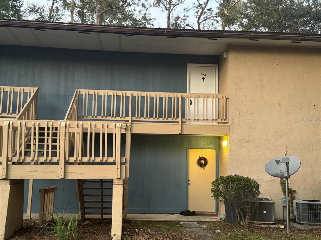 2811 Southwest Archer Road, Unit R144 Gainesville, FL 32608 - Photo 2 of 12 a front view of a house with parking space