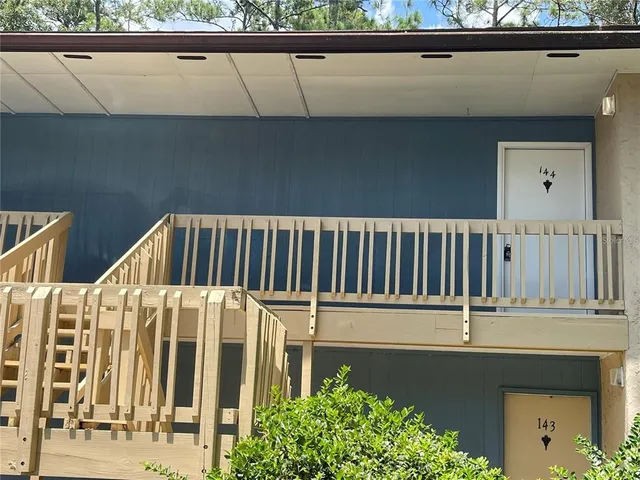 a view of balcony with furniture