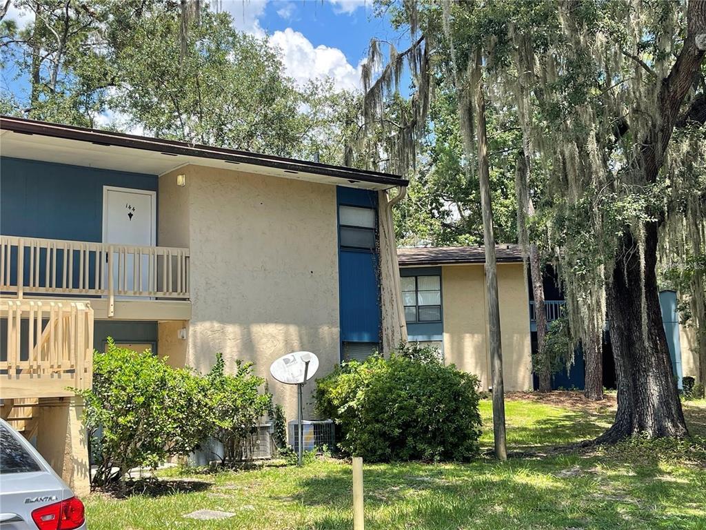 2811 Southwest Archer Road, Unit R144 Gainesville, FL 32608 - Photo 4 of 12 a front view of a house with garden