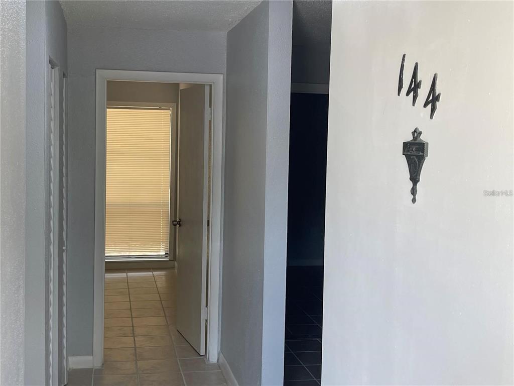 2811 Southwest Archer Road, Unit R144 Gainesville, FL 32608 - Photo 5 of 12 a view of a closet from a bathroom