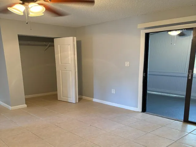 an empty room with closet area