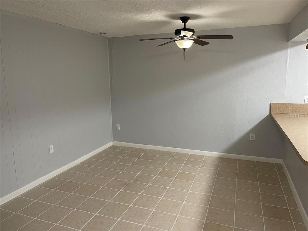 2811 Southwest Archer Road, Unit R144 Gainesville, FL 32608 - Photo 8 of 12 en view of an empty room with chandelier fan