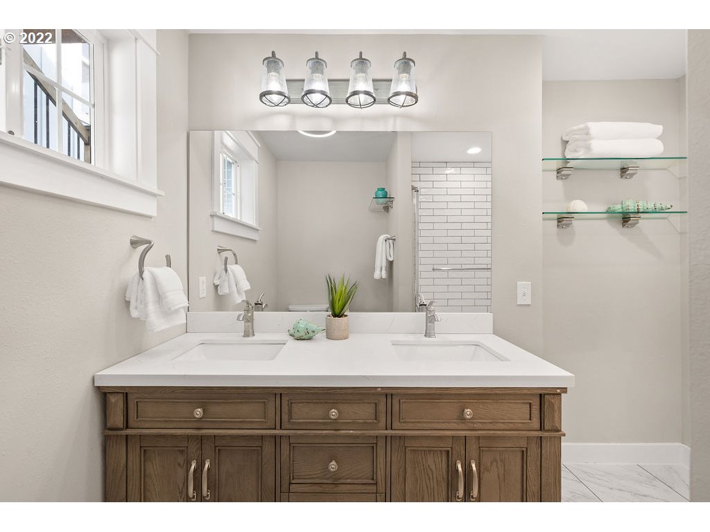 91158 Youngs River Road Astoria, OR 97103 - Photo 19 of 32 a bathroom with a sink vanity and a mirror