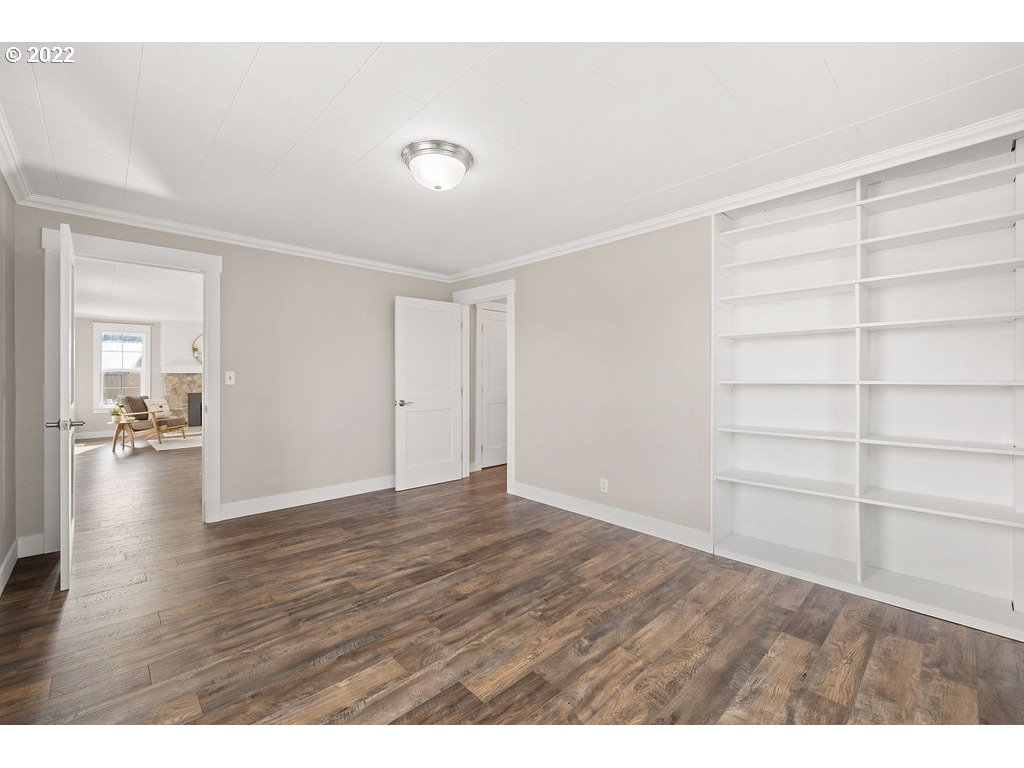 91158 Youngs River Road Astoria, OR 97103 - Photo 20 of 32 a view of an empty room with wooden floor