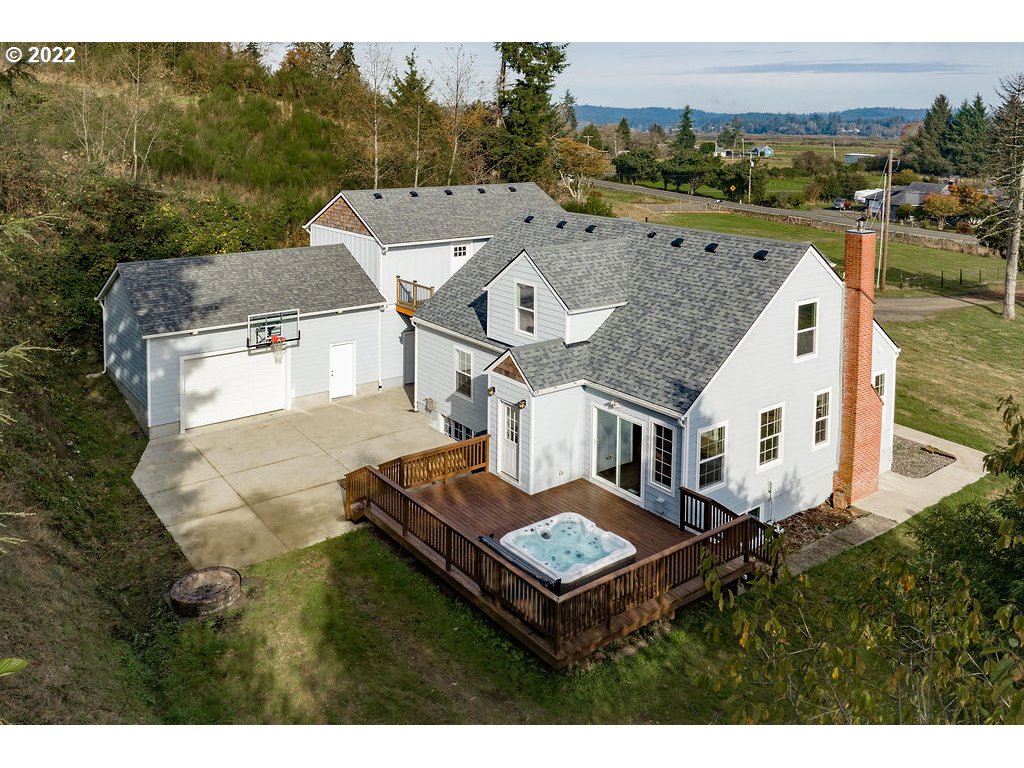 91158 Youngs River Road Astoria, OR 97103 - Photo 28 of 32 a aerial view of a house next to a big yard