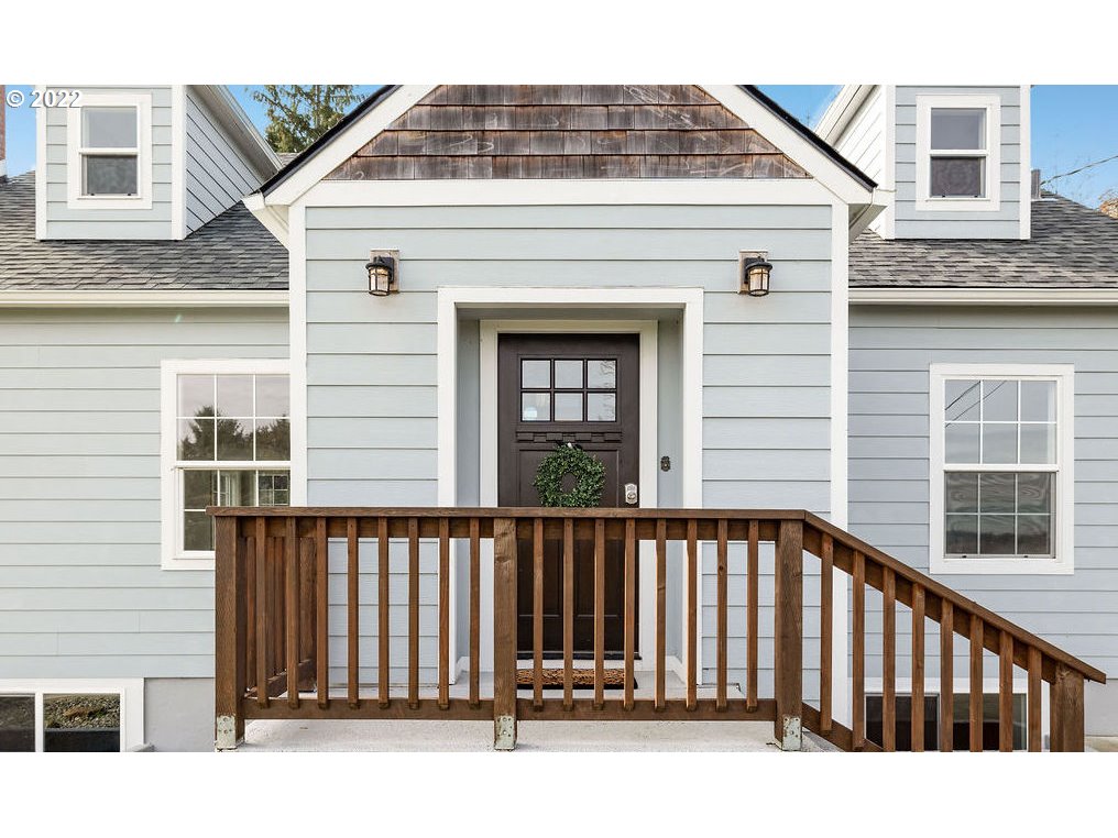 91158 Youngs River Road Astoria, OR 97103 - Photo 3 of 32 a view of a wooden house with a small yard