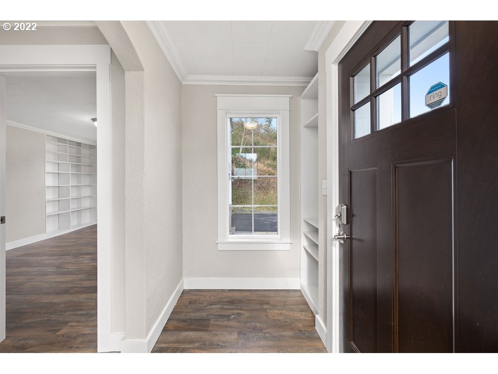 91158 Youngs River Road Astoria, OR 97103 - Photo 5 of 32 a view of an empty room with a window