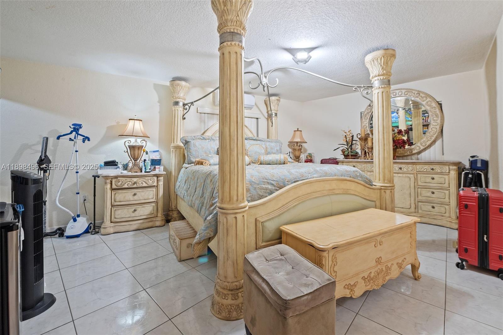 100 East 37th Street Hialeah, FL 33013 - Photo 15 of 25 a living room with furniture a chandelier and a window