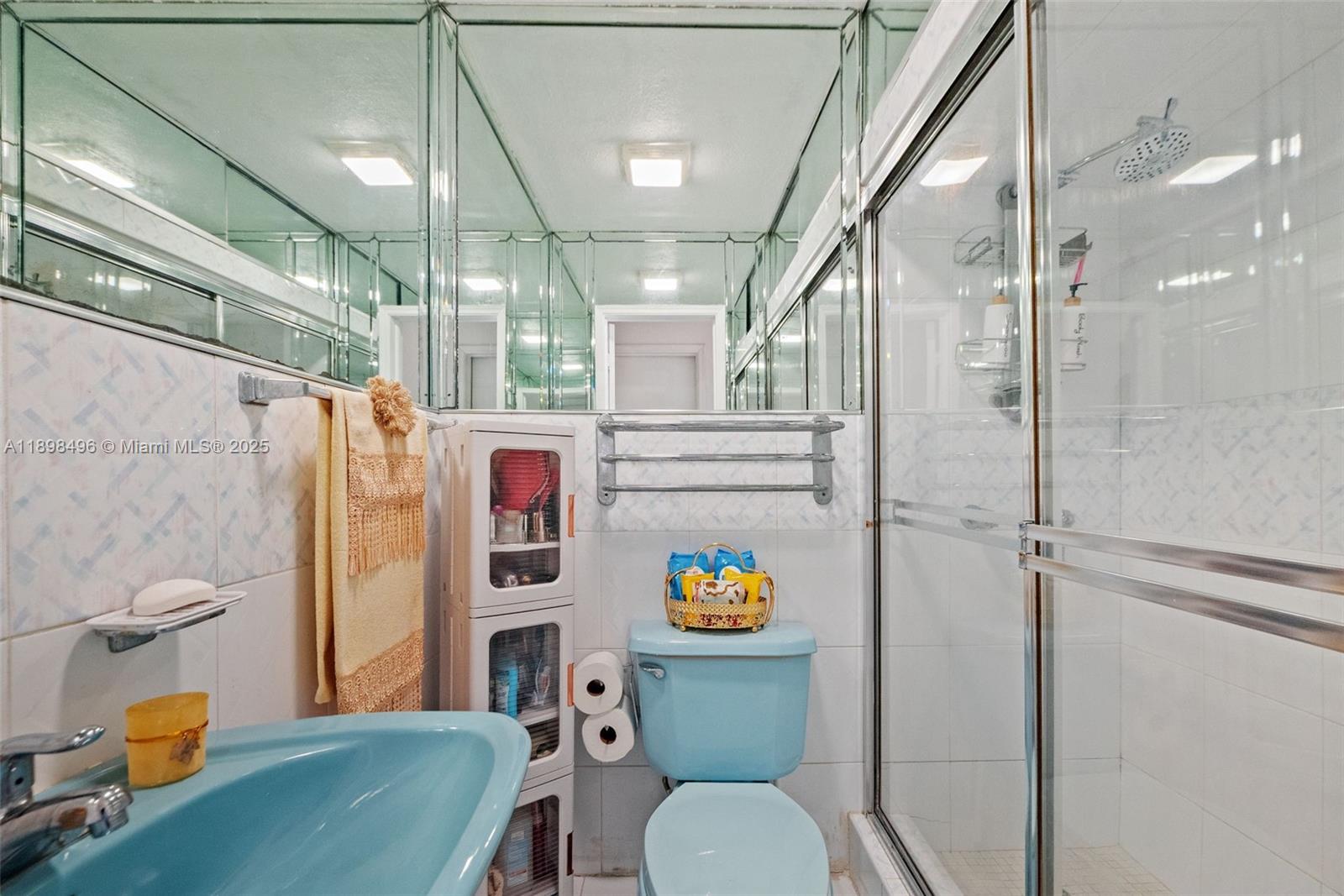 100 East 37th Street Hialeah, FL 33013 - Photo 16 of 25 a bathroom with a toilet a sink and shower