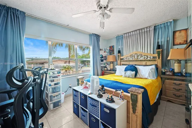 a bed room with a bed and a chandelier