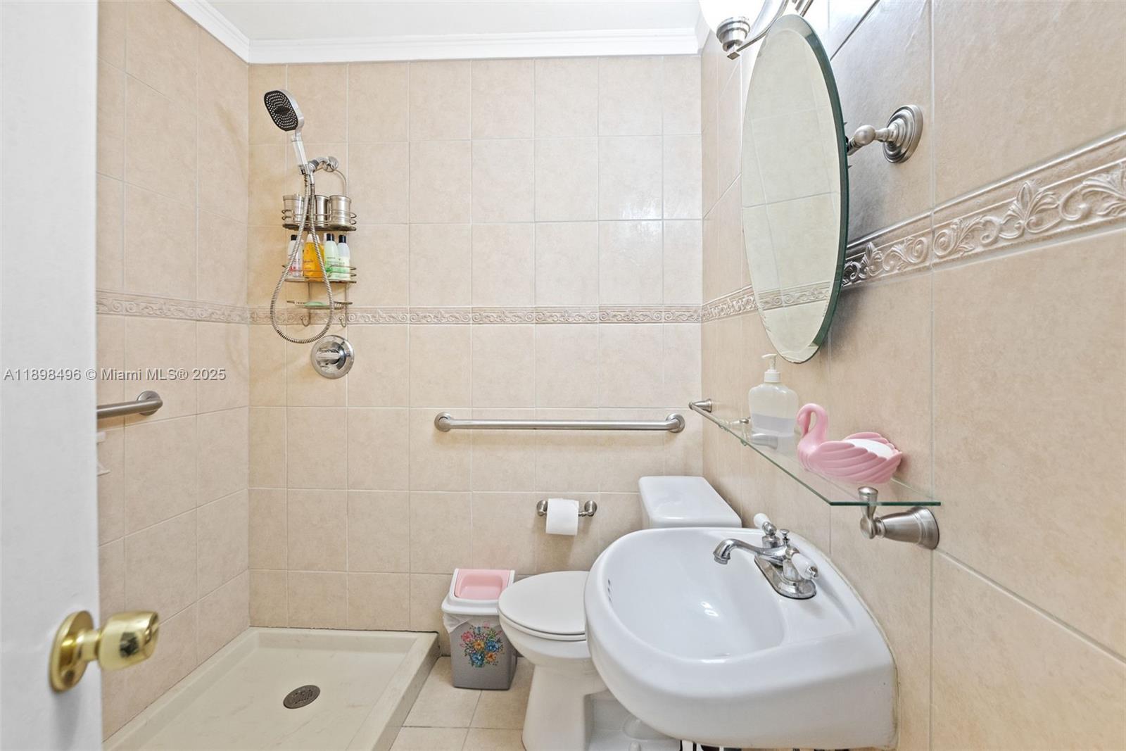 100 East 37th Street Hialeah, FL 33013 - Photo 20 of 25 a bathroom with a sink a toilet and shower
