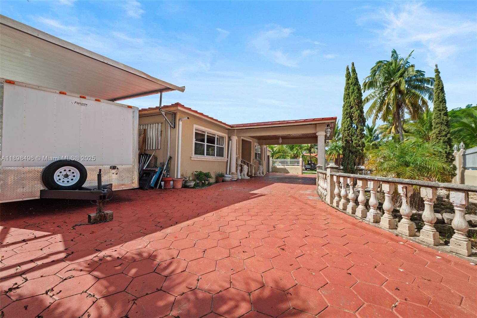 100 East 37th Street Hialeah, FL 33013 - Photo 2 of 25 a front view of a house with garden