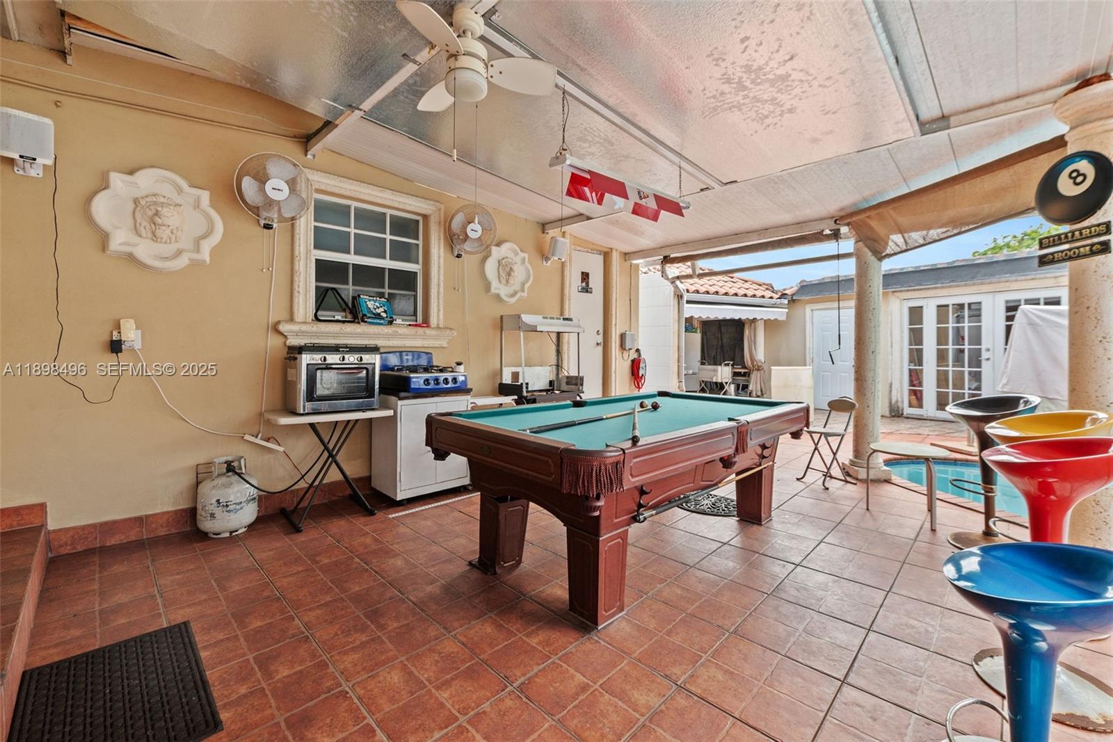 100 East 37th Street Hialeah, FL 33013 - Photo 23 of 25 a room with pool table and windows