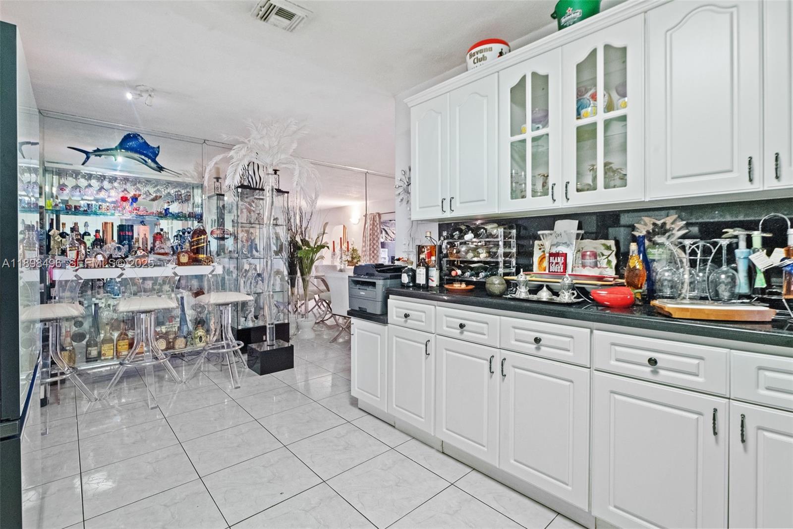 100 East 37th Street Hialeah, FL 33013 - Photo 10 of 25 a kitchen with refrigerator and cabinets