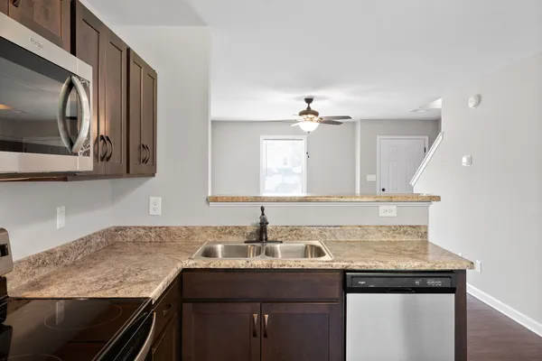 a kitchen with a sink and cabinets