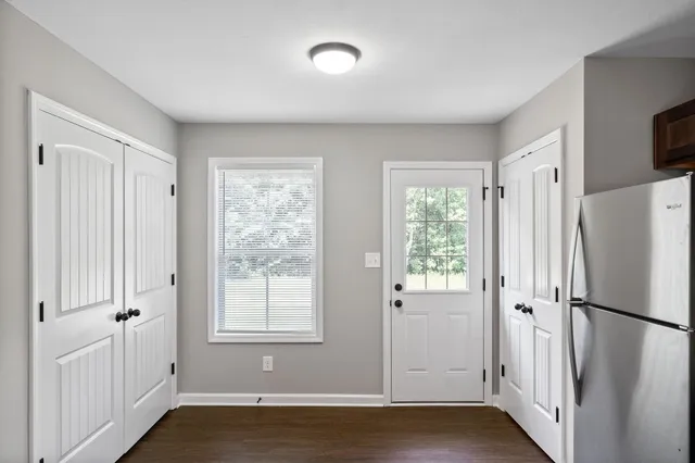 a view of a hardwood floor in a room
