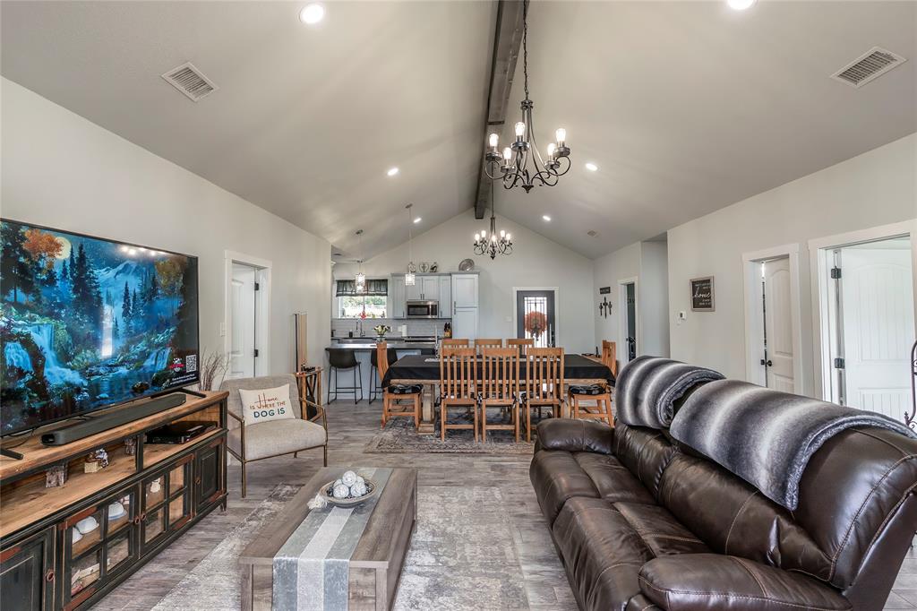 140 Lago Lane Nocona, TX 76255 - Photo 11 of 39 a living room with furniture a flat screen tv and kitchen view