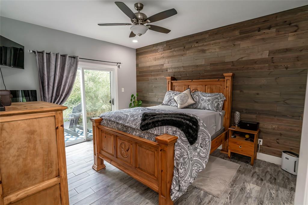 140 Lago Lane Nocona, TX 76255 - Photo 15 of 39 a bedroom with a bed and a television