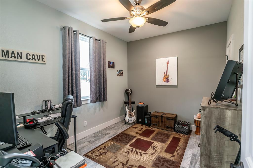 140 Lago Lane Nocona, TX 76255 - Photo 20 of 39 a view of a workspace with furniture and a window