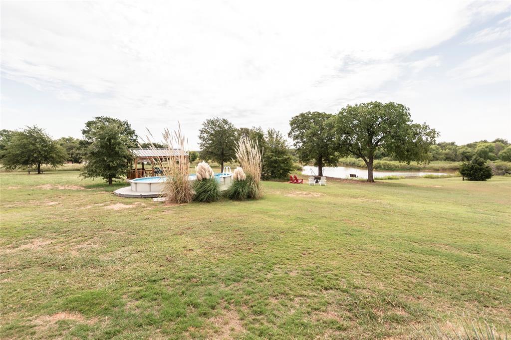 140 Lago Lane Nocona, TX 76255 - Photo 25 of 39 a view of a lake with houses