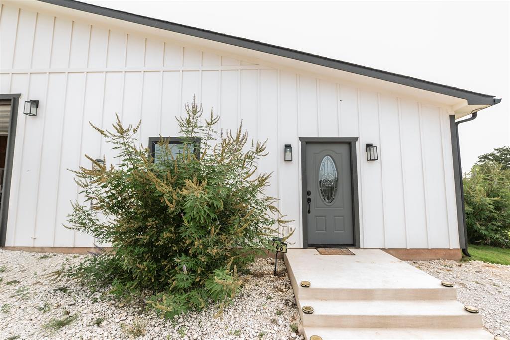 140 Lago Lane Nocona, TX 76255 - Photo 27 of 39 a front view of a house