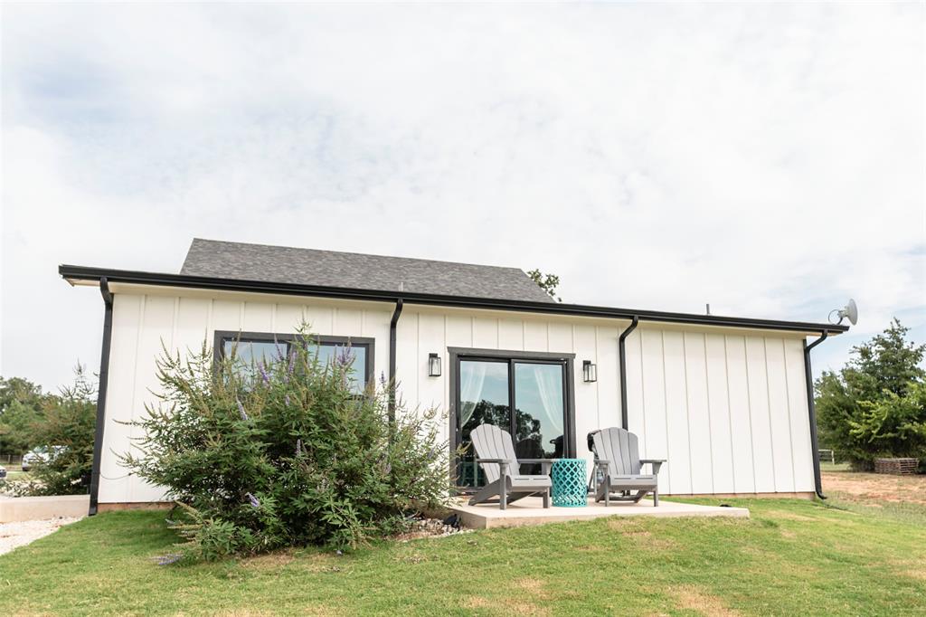 140 Lago Lane Nocona, TX 76255 - Photo 28 of 39 a view of a house with backyard and sitting area