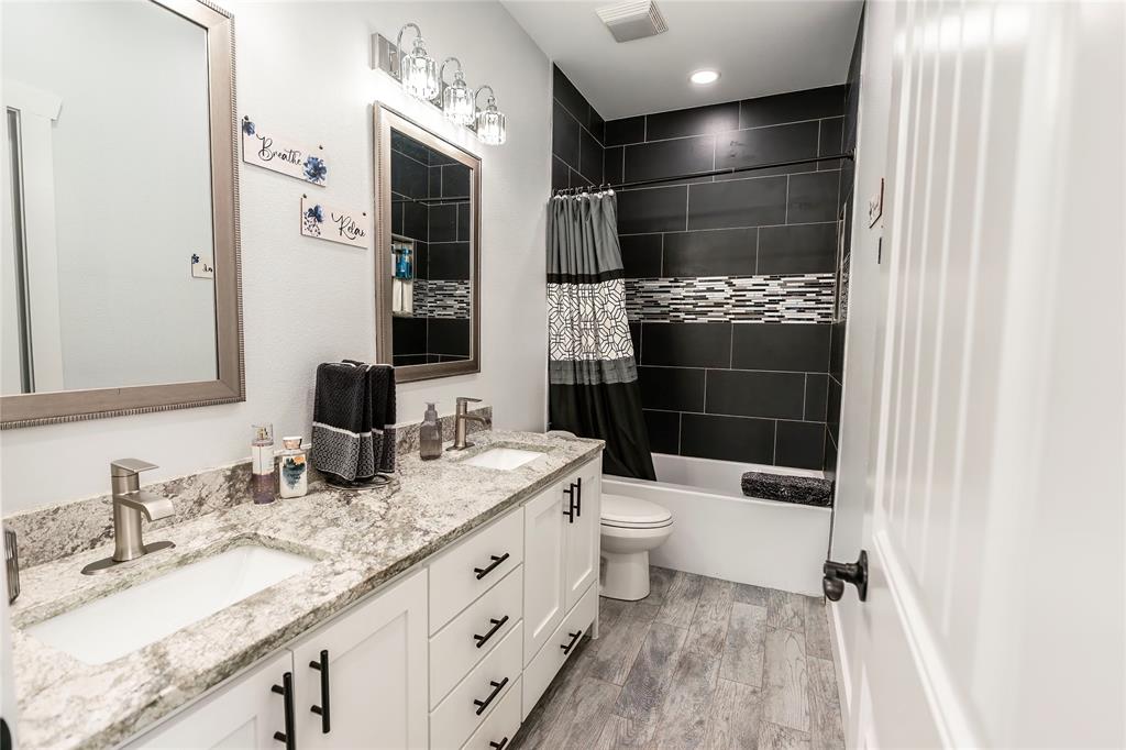 140 Lago Lane Nocona, TX 76255 - Photo 32 of 39 a bathroom with a sink a toilet and shower