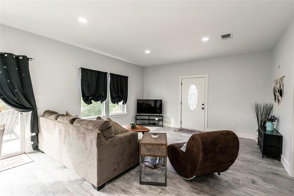 140 Lago Lane Nocona, TX 76255 - Photo 34 of 39 a living room with furniture and a flat screen tv