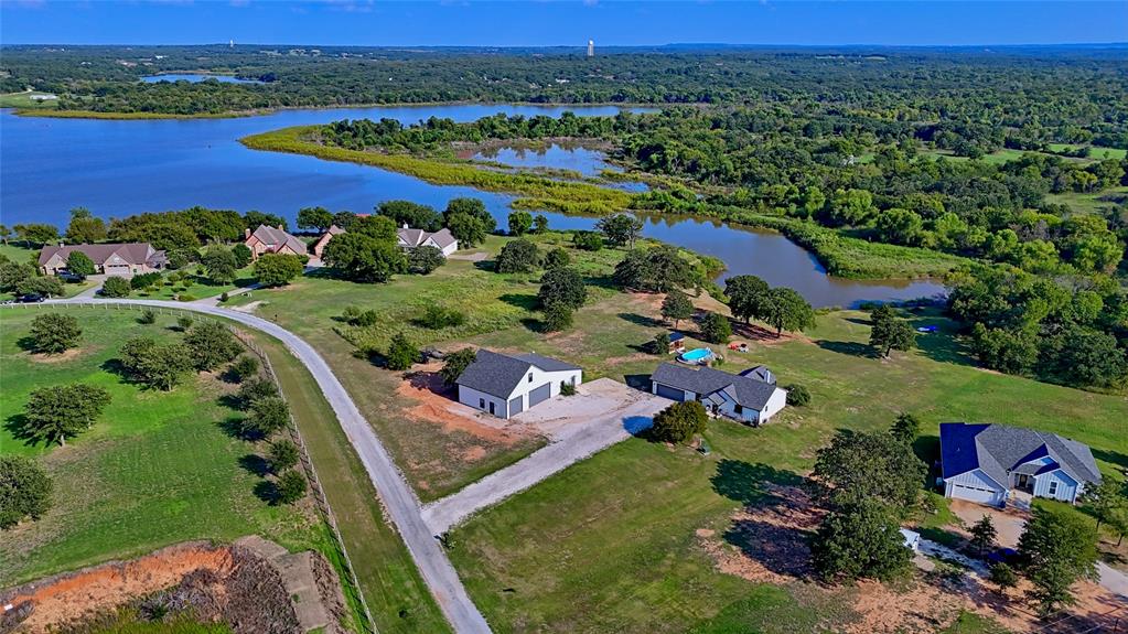 140 Lago Lane Nocona, TX 76255 - Photo 4 of 39 an aerial view of residential houses with outdoor space