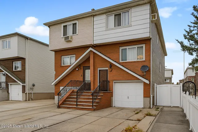 a front view of a house with a stairs