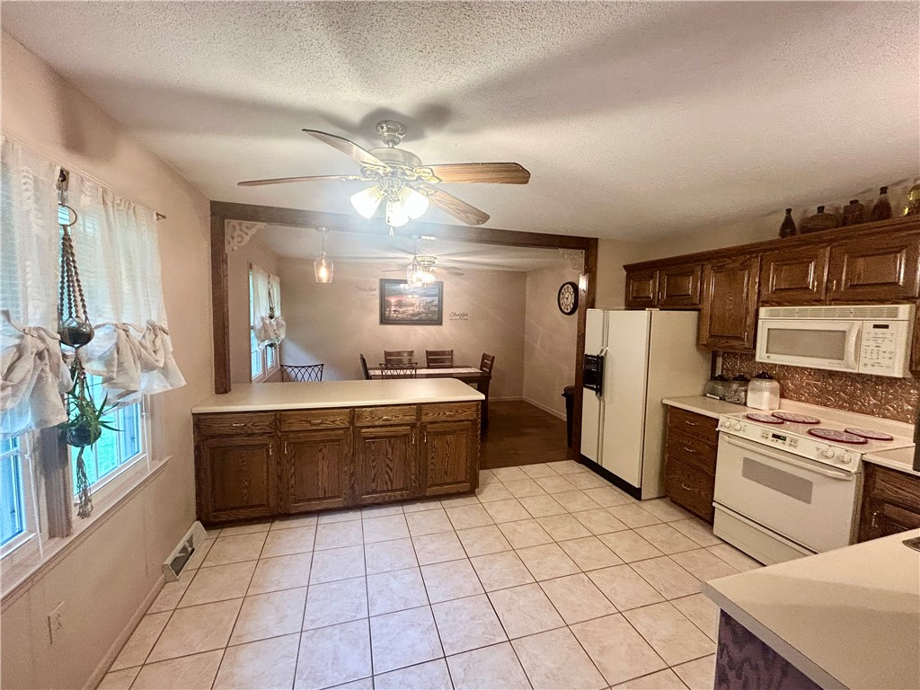 307 Mar-Mac Road Anderson, SC 29626 - Photo 6 of 19 Functional kitchen offering ample counter space, rich wood cabinetry, and an open layout connecting to the dining area.