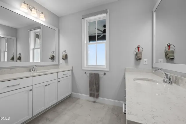 a bedroom with furniture and a flat screen tv