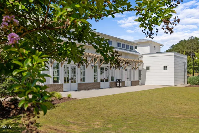 a view of house with yard