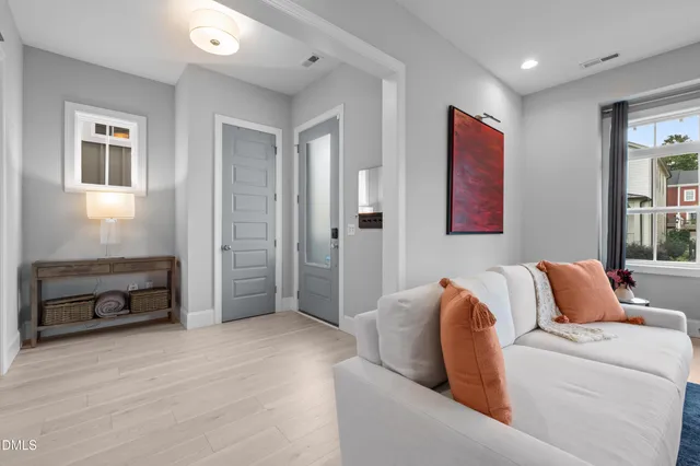 a view of a livingroom with furniture and a flat screen tv