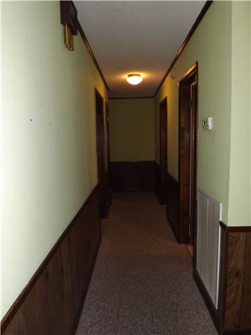 680 Maple Springs Road Manchester, TN 37355 - Photo 8 of 15 Down the hallway, you will find three bedrooms and a full bathroom.