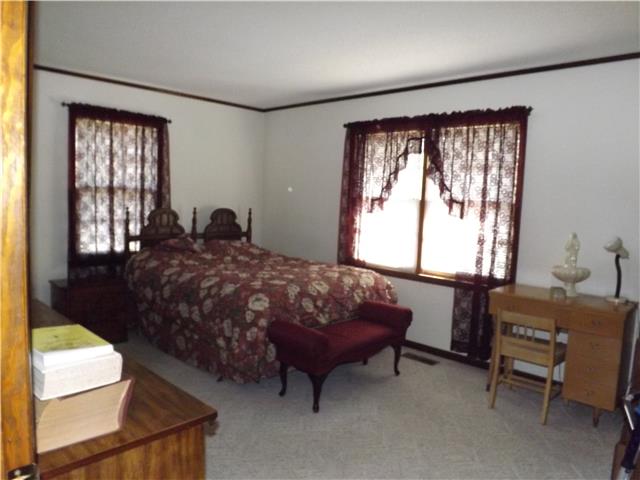 680 Maple Springs Road Manchester, TN 37355 - Photo 9 of 15 The master suite features a large room with natural light and an attached full bath.