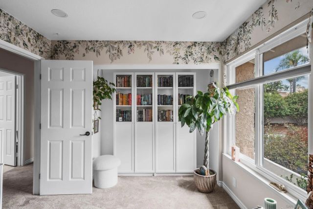 a view of front door and potted plants