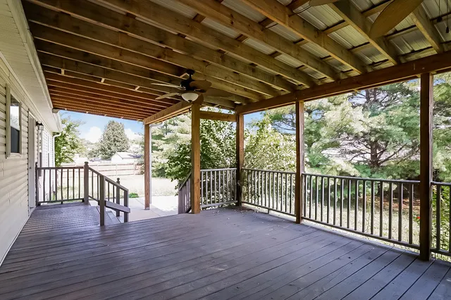 a view of a porch with wooden floor