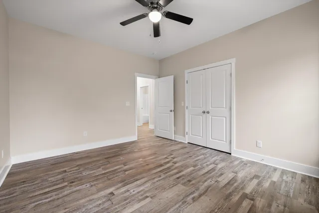 a bedroom with a bed and cabinets