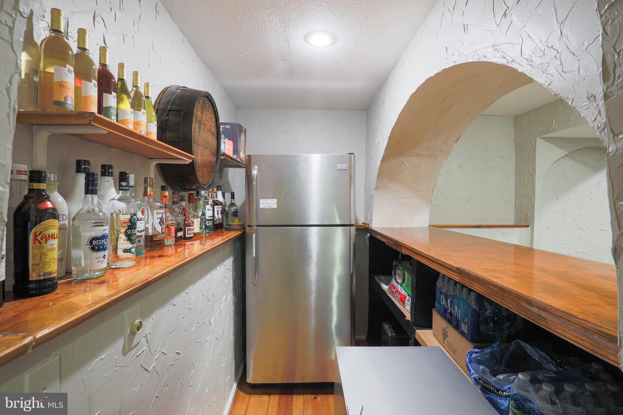 17119 Spates Hill Road Poolesville, MD 20837 - Photo 52 of 72 Bar and fridge