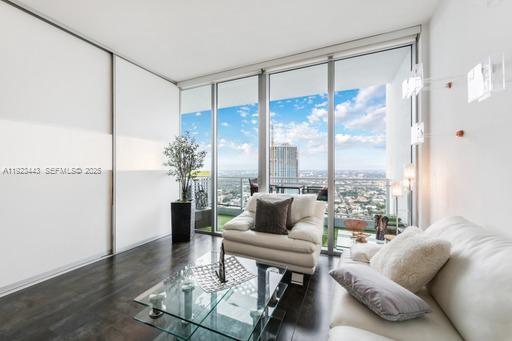 92 Southwest 3rd Street, Unit 5108 Miami, FL 33130 - Photo 6 of 23 a living room with furniture and a large window