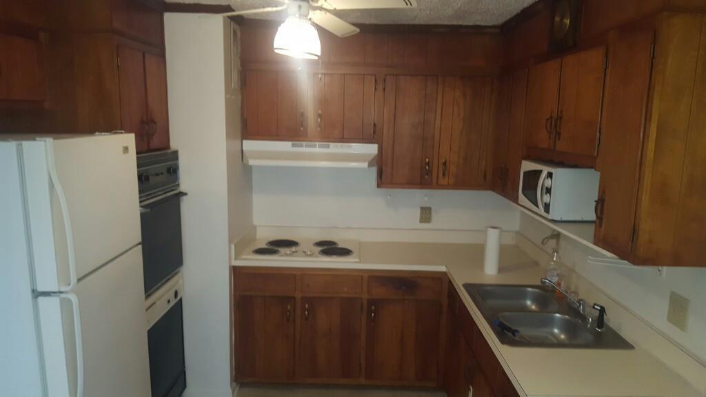2922 Anderson Road Nashville, TN 37217 - Photo 4 of 10 a kitchen with a refrigerator and a sink