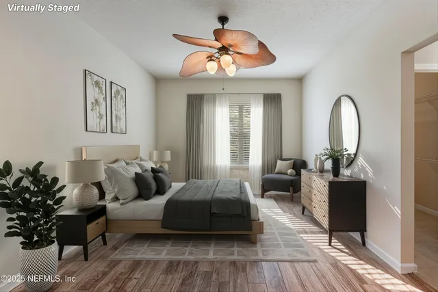 a bedroom with furniture and wooden floor