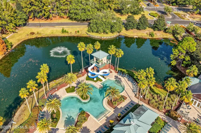 a front view of a building with a garden