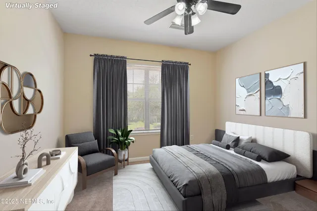 a bedroom with bed and a chandelier