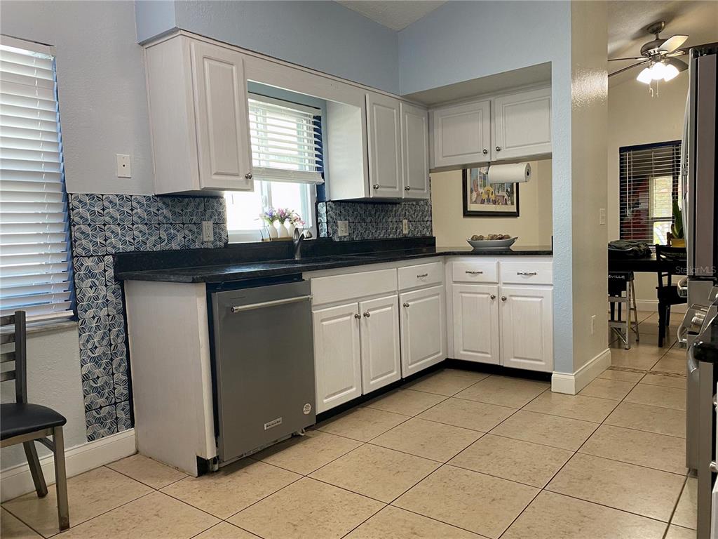1020 Vernon Loop Oviedo, FL 32765 - Photo 11 of 34 a kitchen with a cabinets a sink and appliances