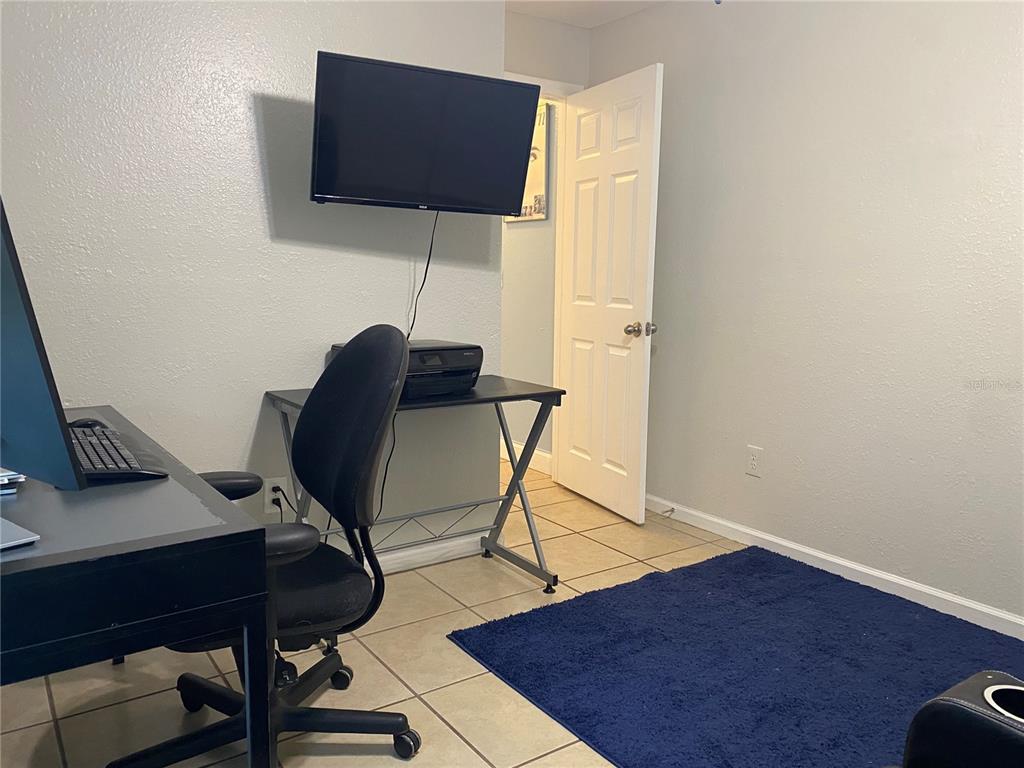 1020 Vernon Loop Oviedo, FL 32765 - Photo 22 of 34 a view of workspace with wooden floor windows