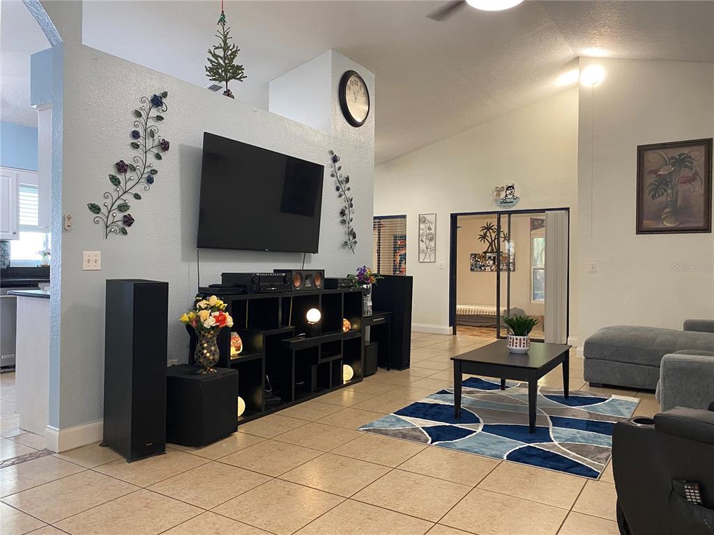 1020 Vernon Loop Oviedo, FL 32765 - Photo 5 of 34 a living room with furniture and a flat screen tv