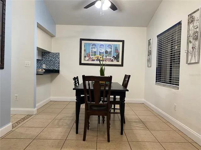 a dining room with furniture and window